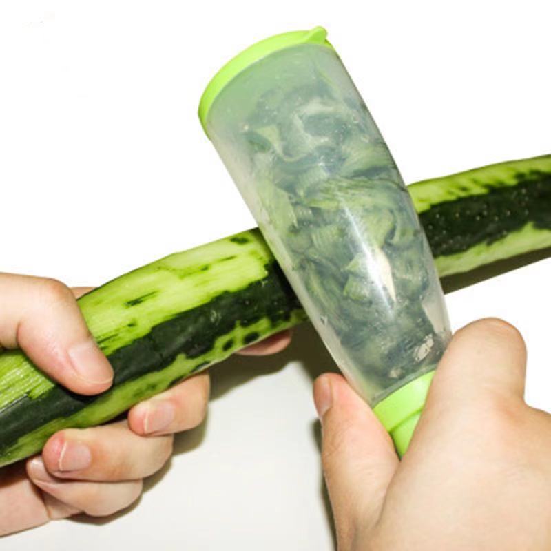 Kanevo Kitchen vegetable peeler being used to peel a cucumber