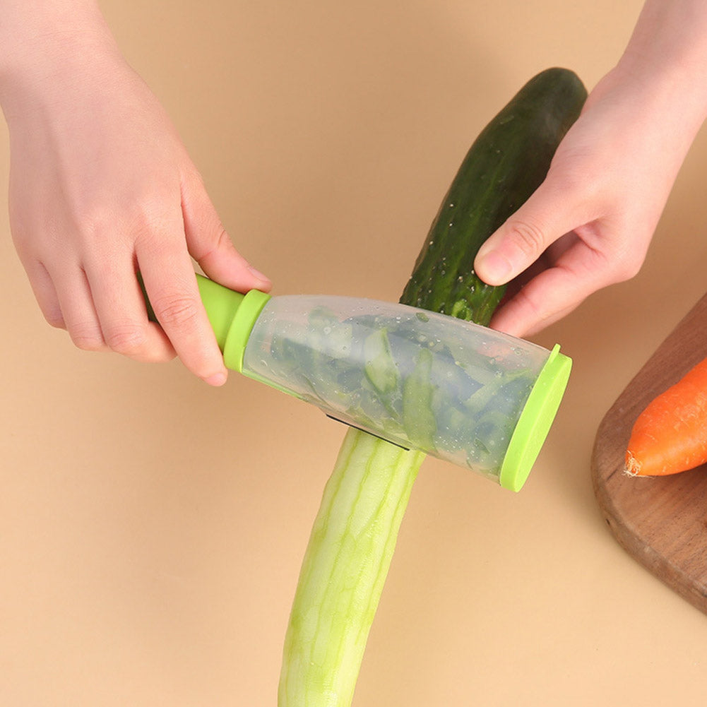 Kanevo Kitchen vegetable peeler used to peel a cucumber